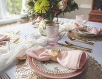 Vintage plates pair well with gold flatware and romantic table decor