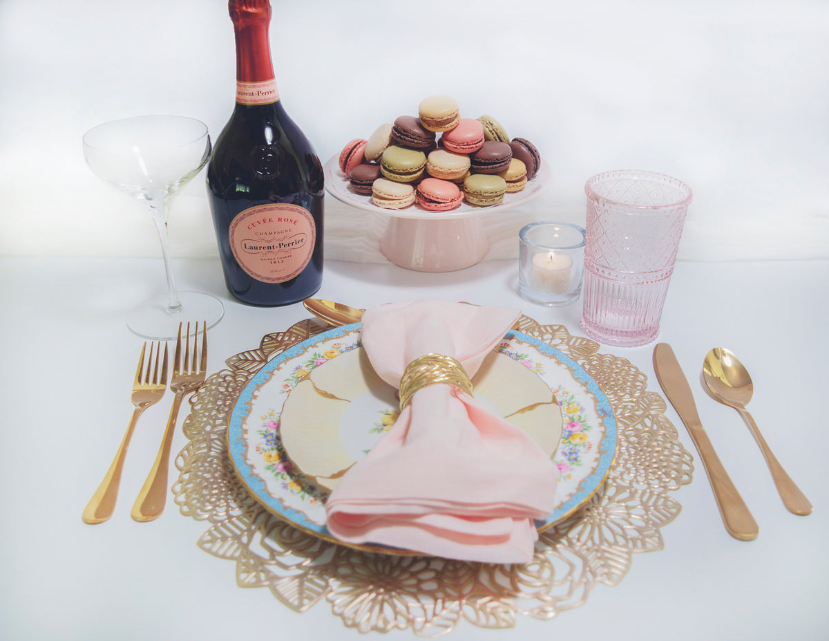 Vintage plates, macaroons, and bubbly make great tableware
