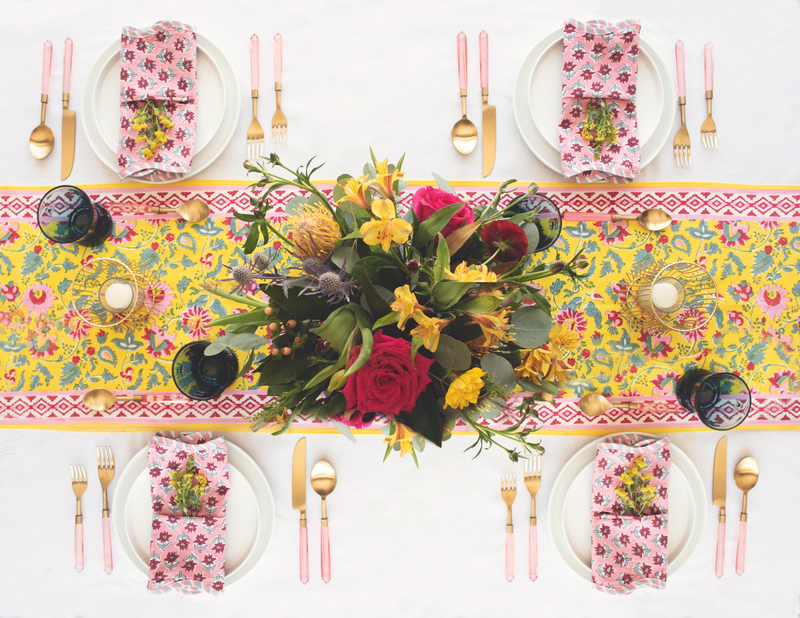 Spring and summer tabletop rental with prism flatware and turquoise bee glasses